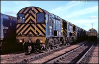08343 heads a line of Class 08s at Motherwell